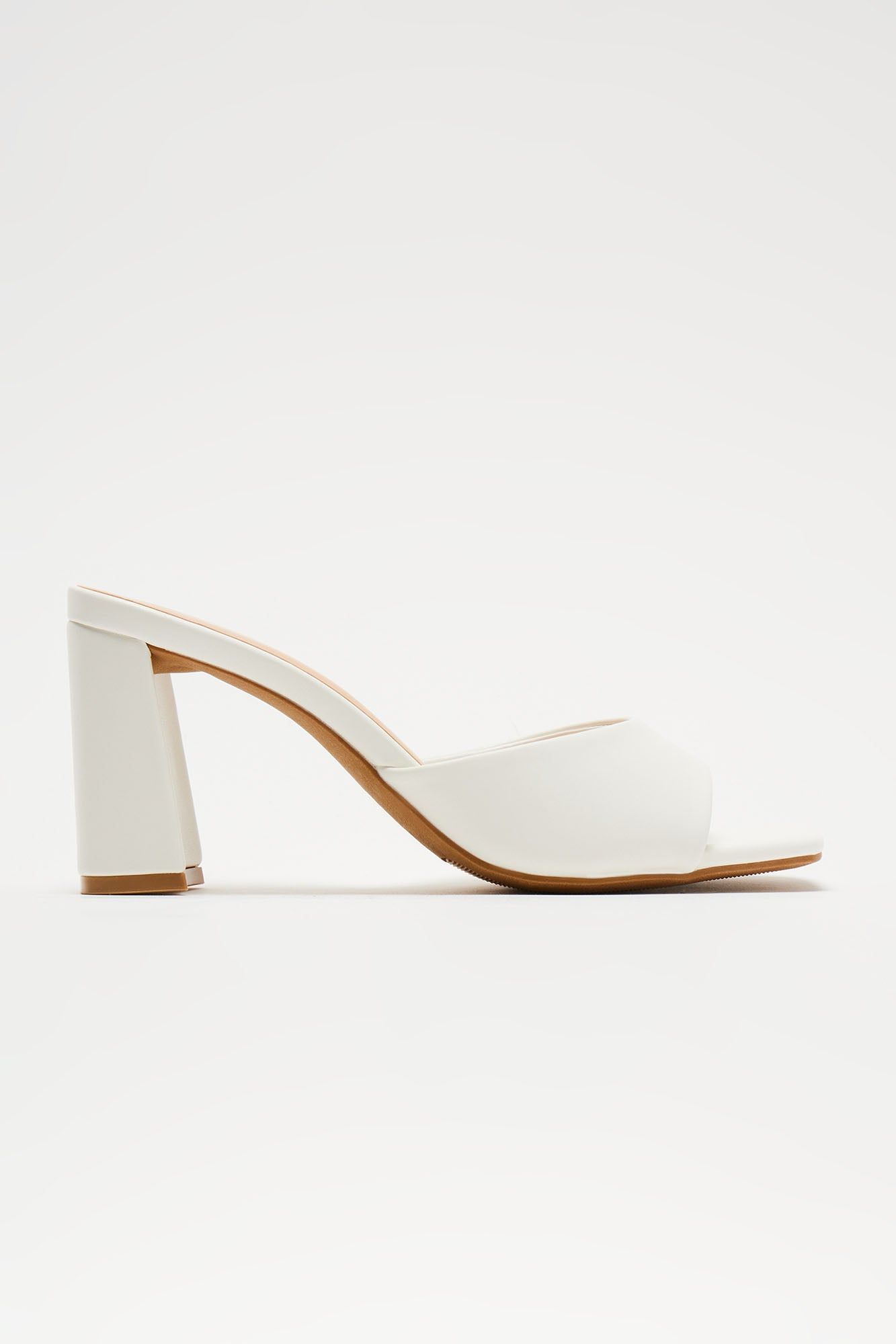 Take Me Somewhere Mules - White sold by Fashion Nova