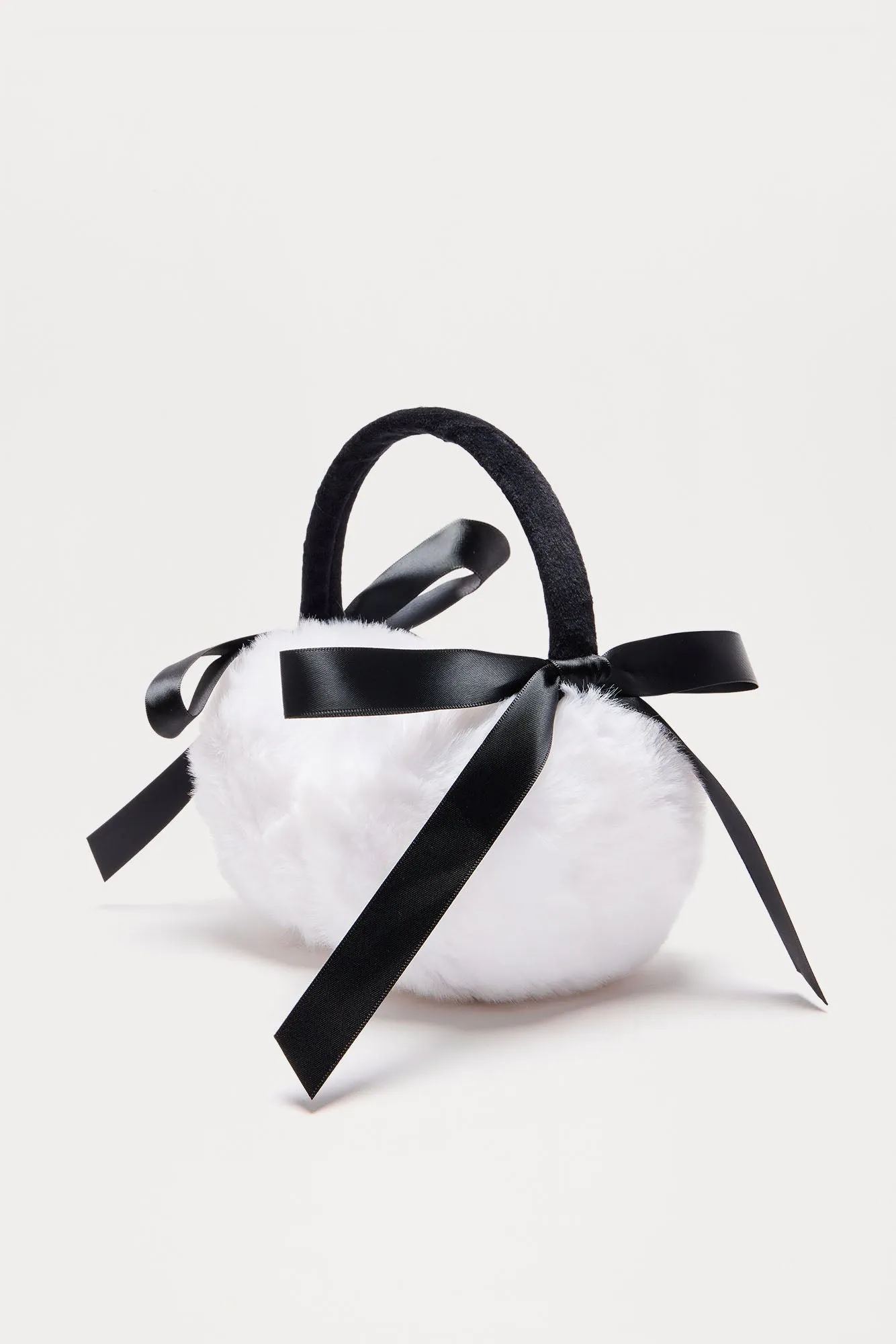 Winter Cutie Bow Earmuffs - Black/White sold by Fashion Nova