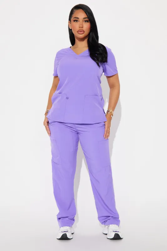 Working Overtime 4FLEX Uniform Scrub Top - Violet sold by Fashion Nova