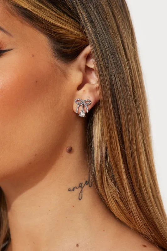 Shiny Bow Earrings - Silver sold by Fashion Nova