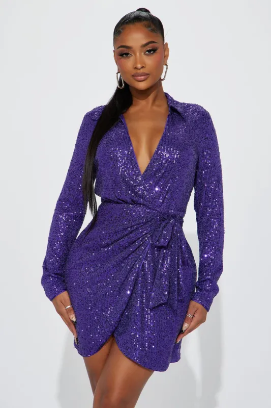 Felicia Wrap Sequin Mini Dress - Purple sold by Fashion Nova