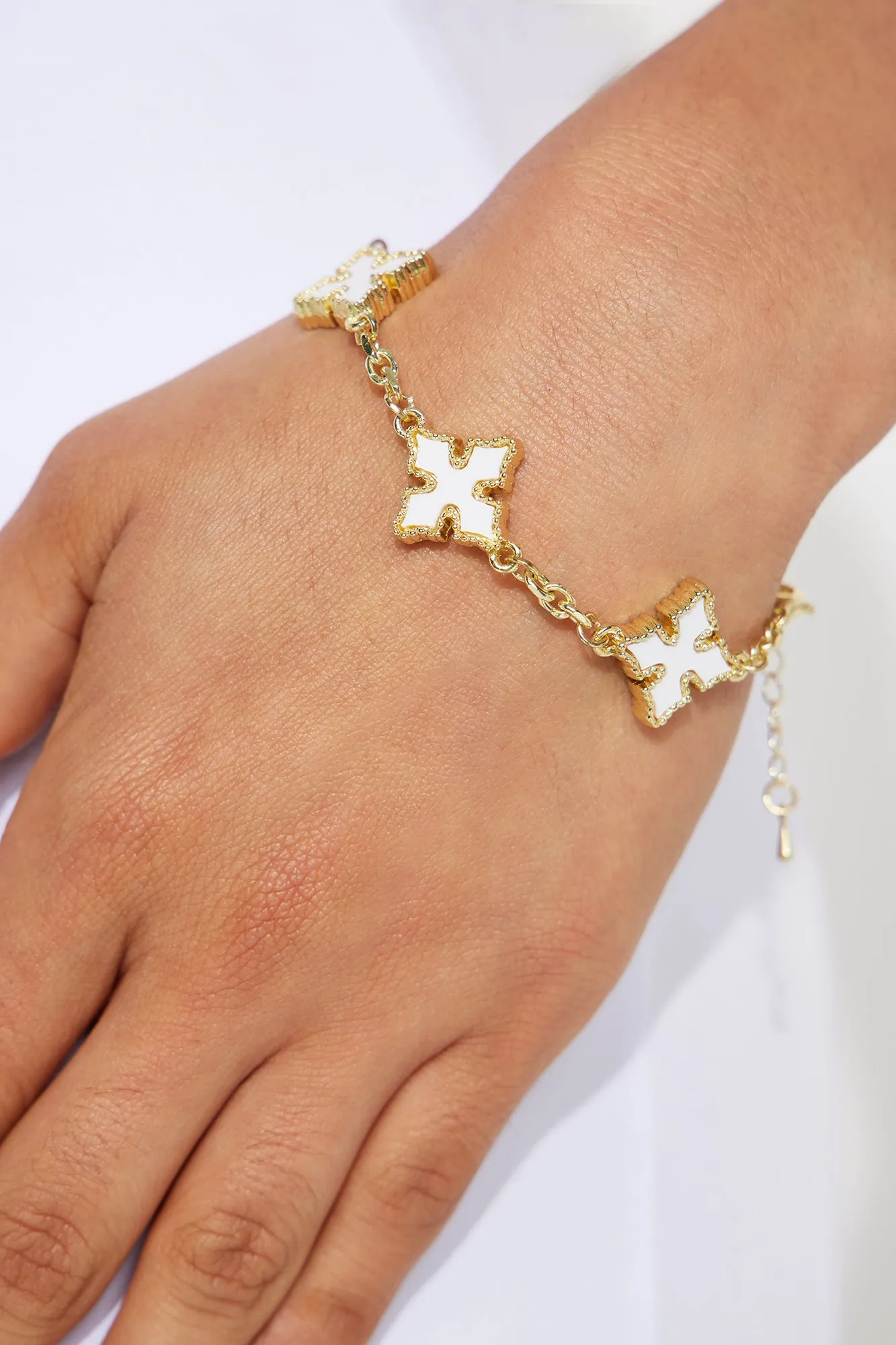 Stays On Me Cross Bracelet - White/Gold sold by Fashion Nova