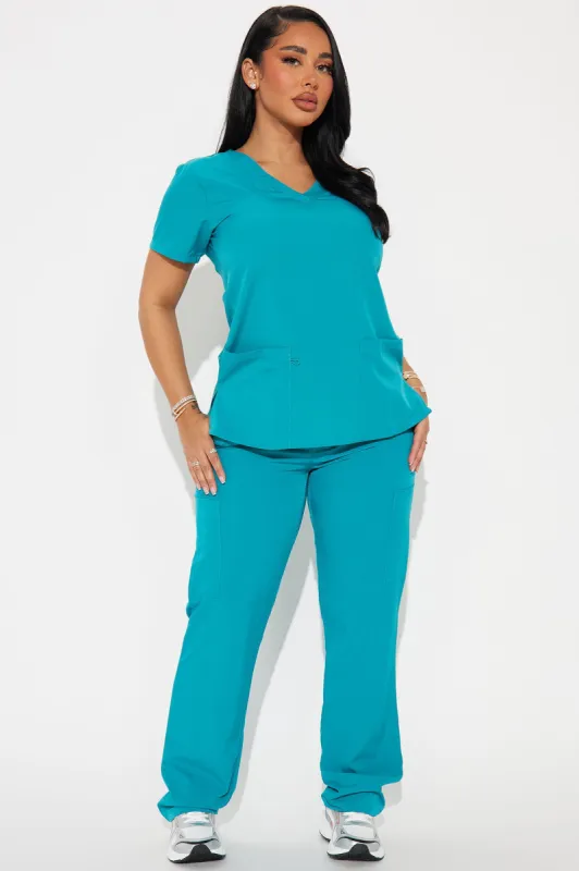 Working Overtime 4FLEX Uniform Scrub Top - Teal sold by Fashion Nova