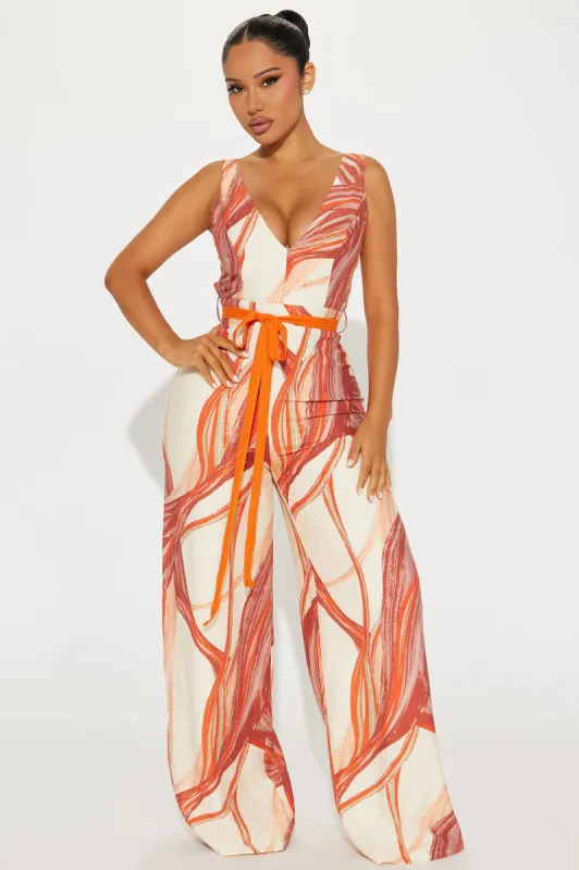 Tropical Sand Jumpsuit  - Orange/combo sold by Fashion Nova