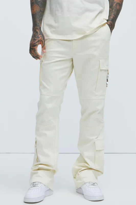 Nikko Slim Flare Pants - Cream sold by Fashion Nova