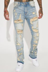 Torn Apart Stacked Skinny Flare Jeans - Light Blue Wash sold by Fashion Nova