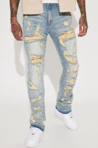 Torn Apart Stacked Skinny Flare Jeans - Light Blue Wash sold by Fashion Nova