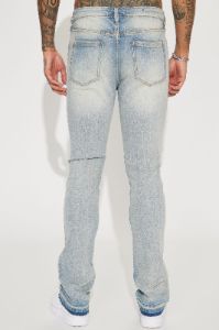 Torn Apart Stacked Skinny Flare Jeans - Light Blue Wash sold by Fashion Nova