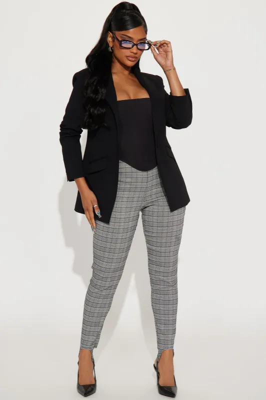 In Between Plaid Stirrup Pant - Black/White sold by Fashion Nova