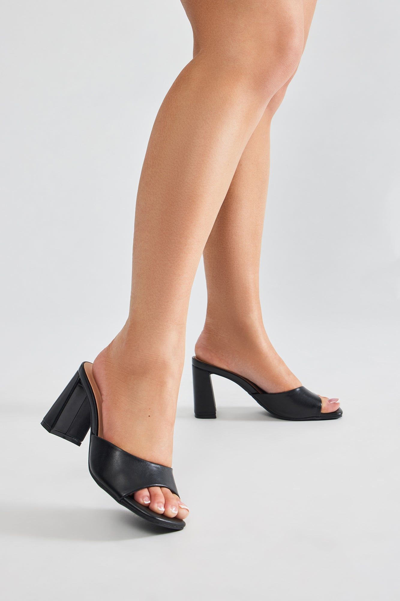 Take Me Somewhere Mules - Black sold by Fashion Nova