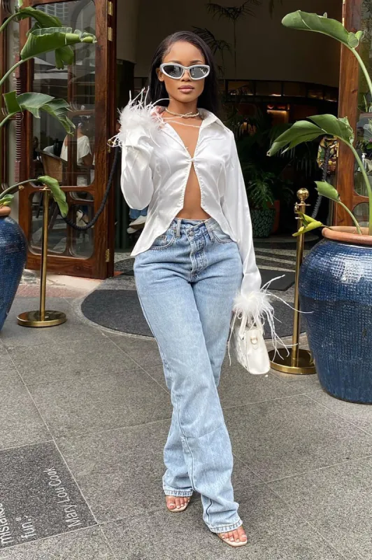 Step Waistband Crossover Jeans - Light Blue Wash sold by Fashion Nova