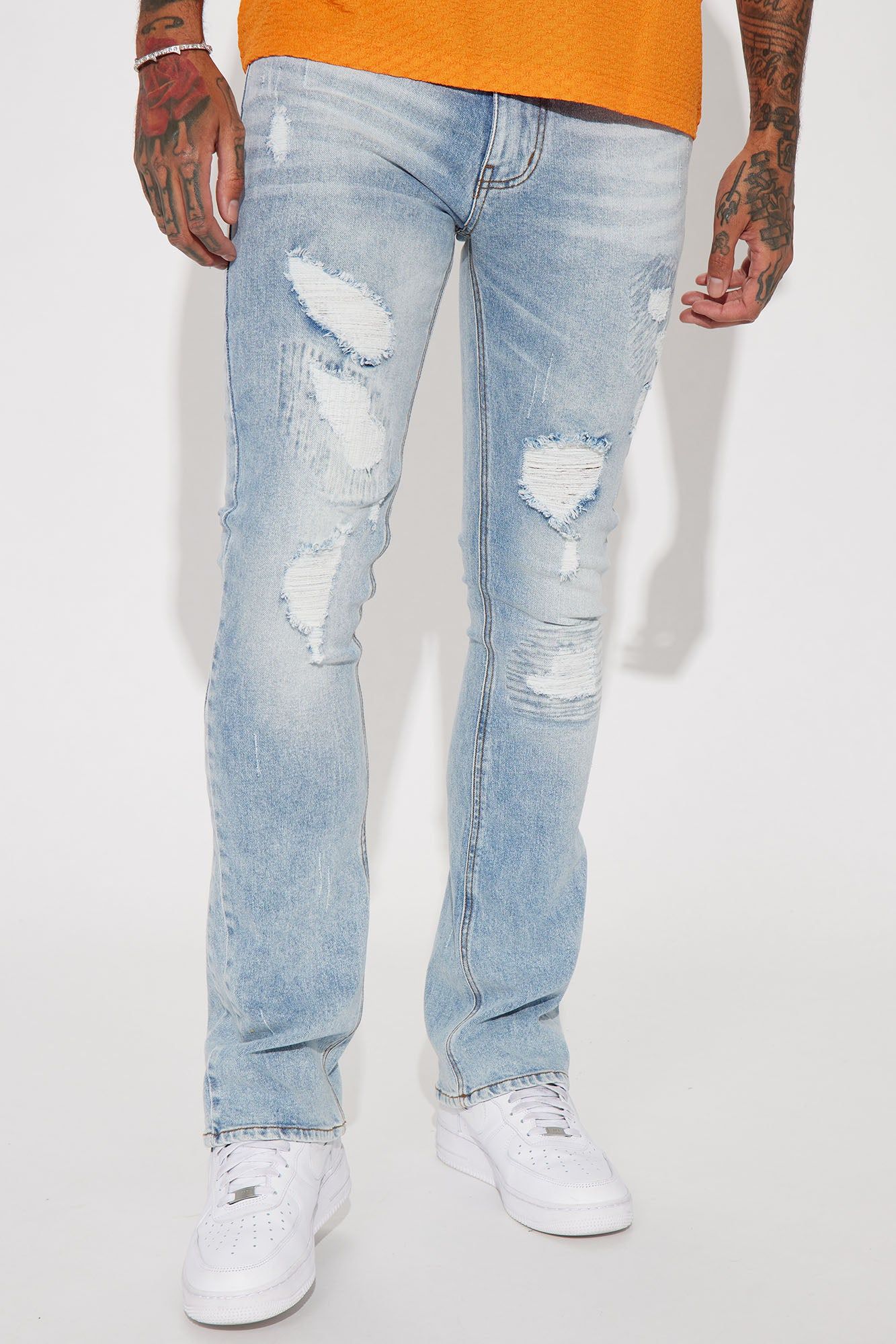 Come Up Ripped Stacked Skinny Flared Jeans - Vintage Blue Wash sold by Fashion Nova
