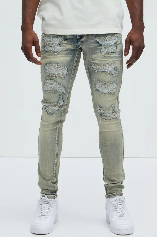 Cut Clean Ripped And Repair Stacked Skinny Jeans - Vintage Blue Wash sold by Fashion Nova