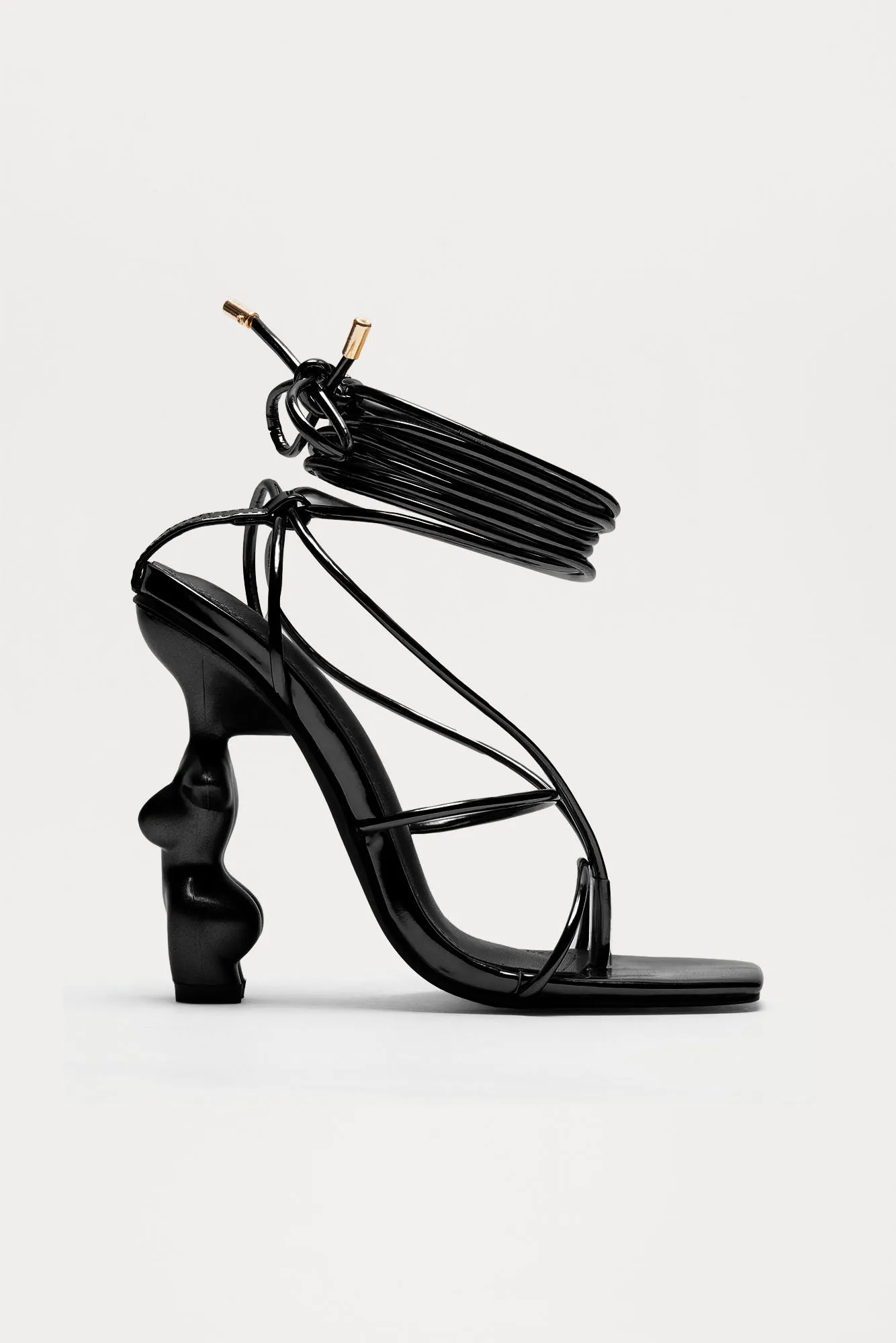 News Worthy Novelty Wrap Up Heels - Black sold by Fashion Nova