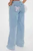 Taking A Bow Embroidered Baggy Jeans - Light Wash sold by Fashion Nova