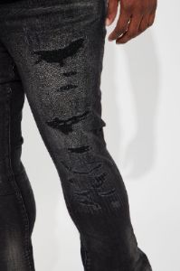 We Out Distressed Stacked Skinny Flare Jeans - Black Wash sold by Fashion Nova