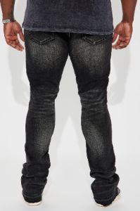 We Out Distressed Stacked Skinny Flare Jeans - Black Wash sold by Fashion Nova