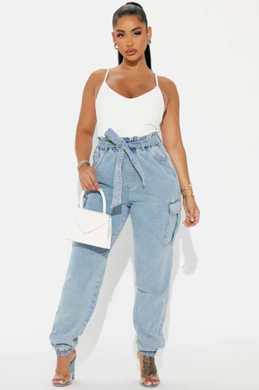 In Her Element Jumpsuit - Light Wash sold by Fashion Nova