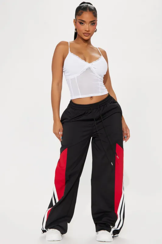 Mark Your Winnings Windbreaker Track Pant - Black/Red sold by Fashion Nova