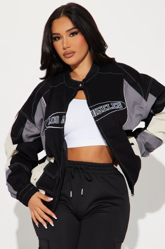 The Land Racing Bomber Jacket - Black/combo sold by Fashion Nova