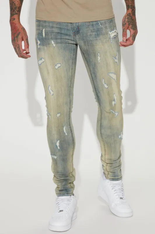 Good Days RIpped Stacked Skinny Jeans - Vintage Blue Wash sold by Fashion Nova