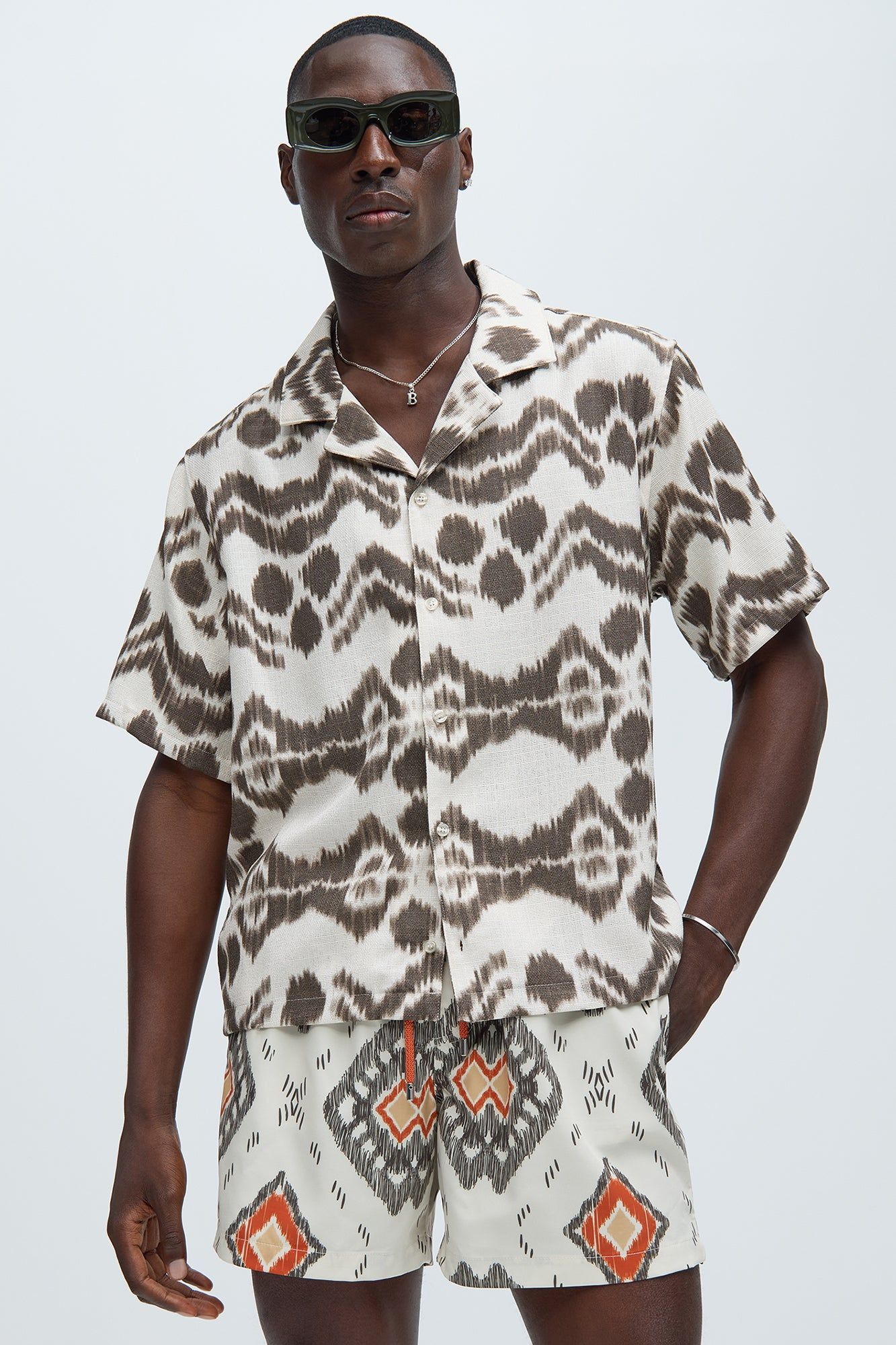 Hidden Skull Shirt - Cream/combo sold by Fashion Nova