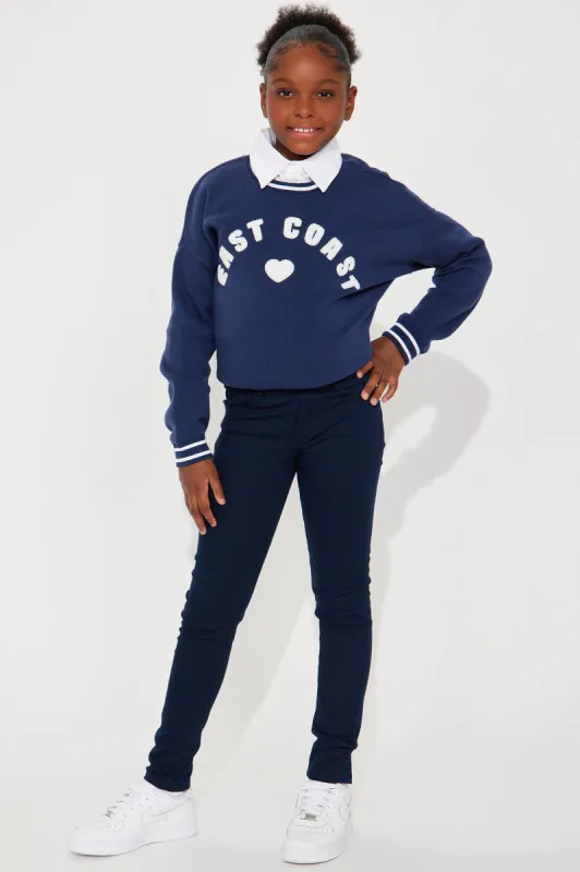 Mini Skinny Uniform Pants - Navy sold by Fashion Nova