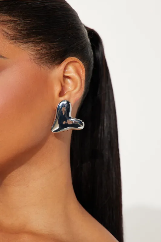 Hearts Of Steel Earrings - Silver sold by Fashion Nova