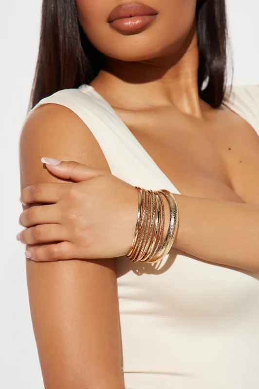 Golden Sunsets 8 Piece Bangle Set - Gold sold by Fashion Nova