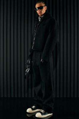 Wilder Textured Weave Flare Slit Trousers - Black sold by Fashion Nova