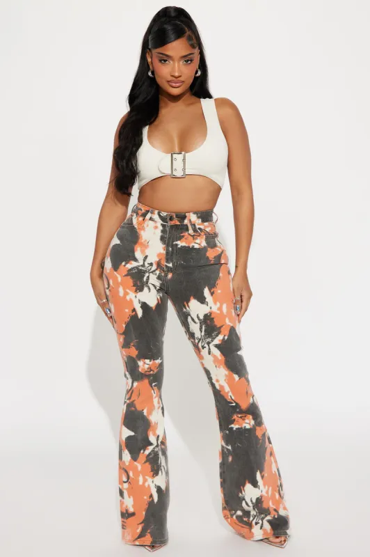 Always Standing Out Stretch Print Flare Jeans - Orange sold by Fashion Nova