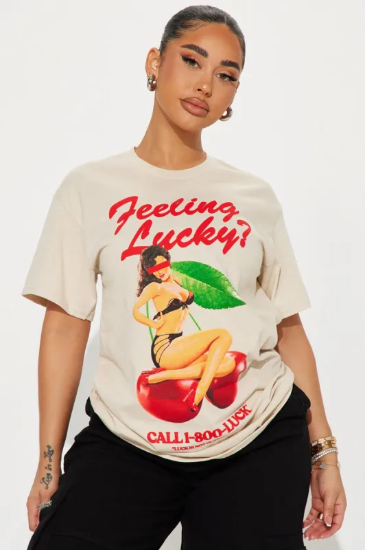 Feeling Lucky Graphic Tee - Taupe sold by Fashion Nova
