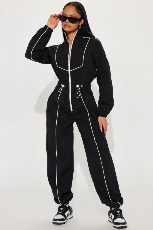 Sporty Love Windbreaker Jumpsuit - Black/White sold by Fashion Nova