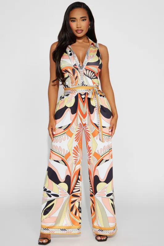 This Energy Jumpsuit  - Yellow/combo sold by Fashion Nova