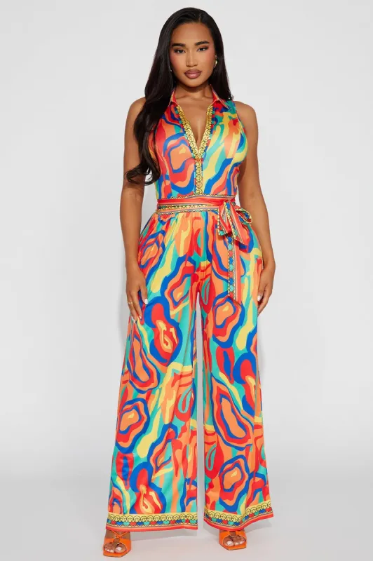 This Energy Jumpsuit  - Red/combo sold by Fashion Nova