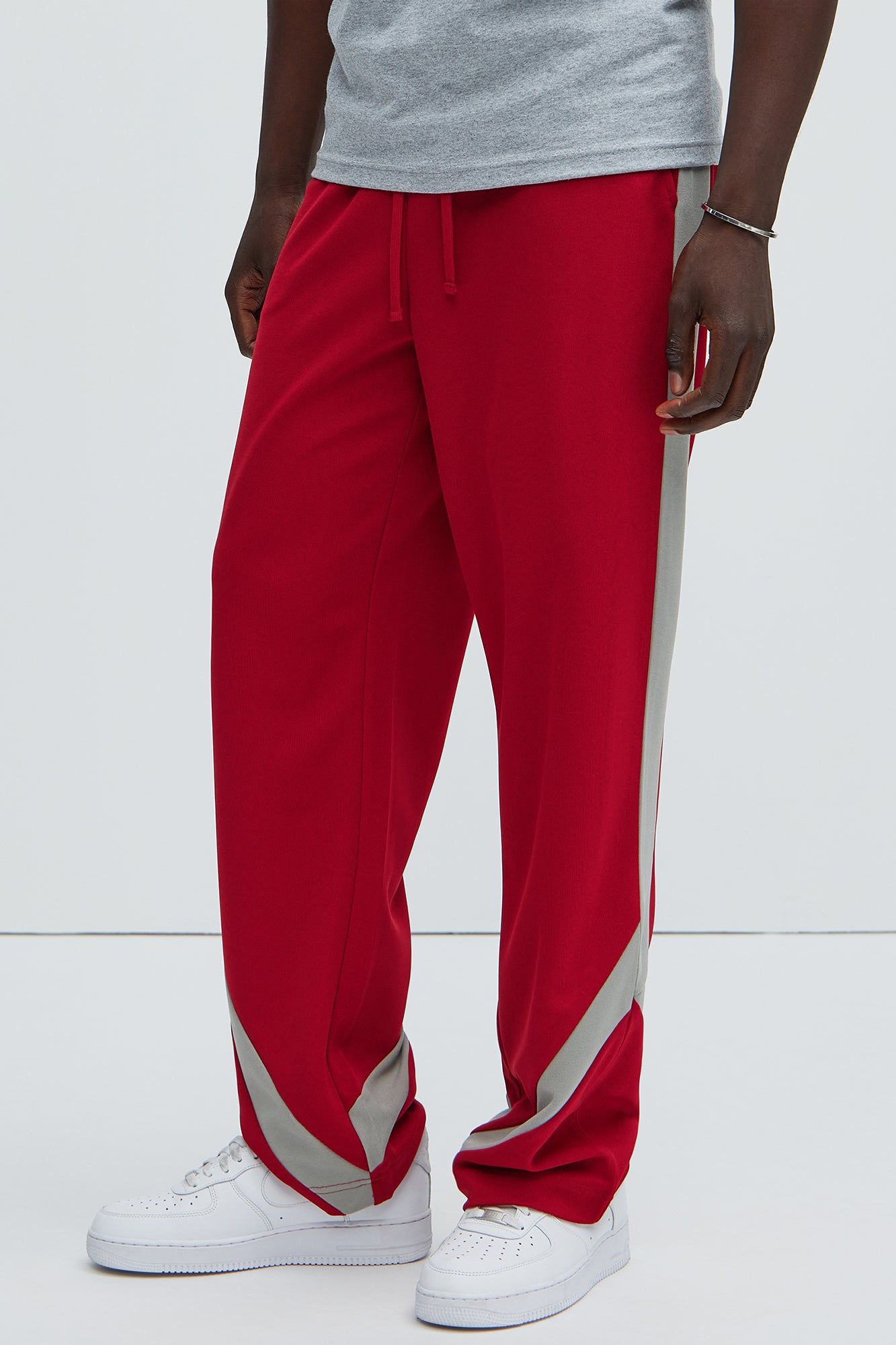 Zedric Relaxed Track Pants - Red sold by Fashion Nova