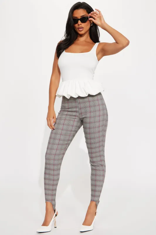 In Between Plaid Stirrup Pant - Black/Red sold by Fashion Nova