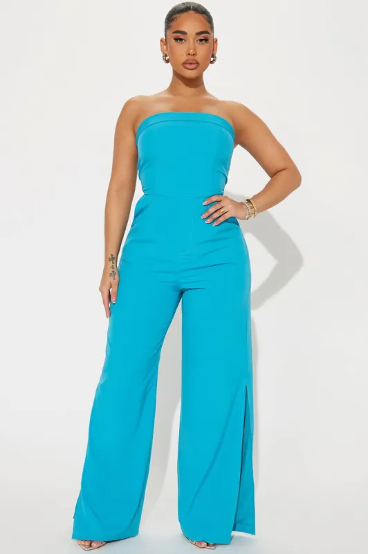 Munira Jumpsuit - Turquoise sold by Fashion Nova