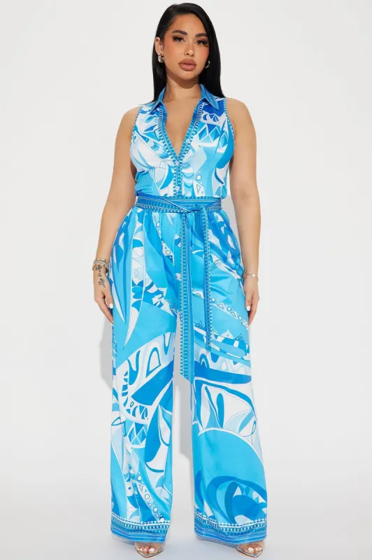 This Energy Jumpsuit  - Blue/combo sold by Fashion Nova