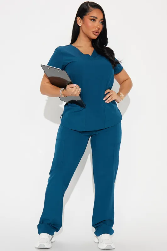 Working Overtime 4FLEX Uniform Scrub Top - Blue sold by Fashion Nova
