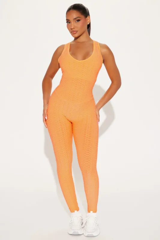The Best Assets Textured Scrunch Butt Jumpsuit - Orange sold by Fashion Nova