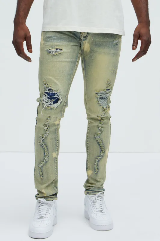 Bleach It With Fray Ripped Stacked Skinny Jeans - Vintage Blue Wash sold by Fashion Nova