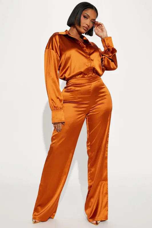 Set The Scene Satin Jumpsuit  - Copper sold by Fashion Nova