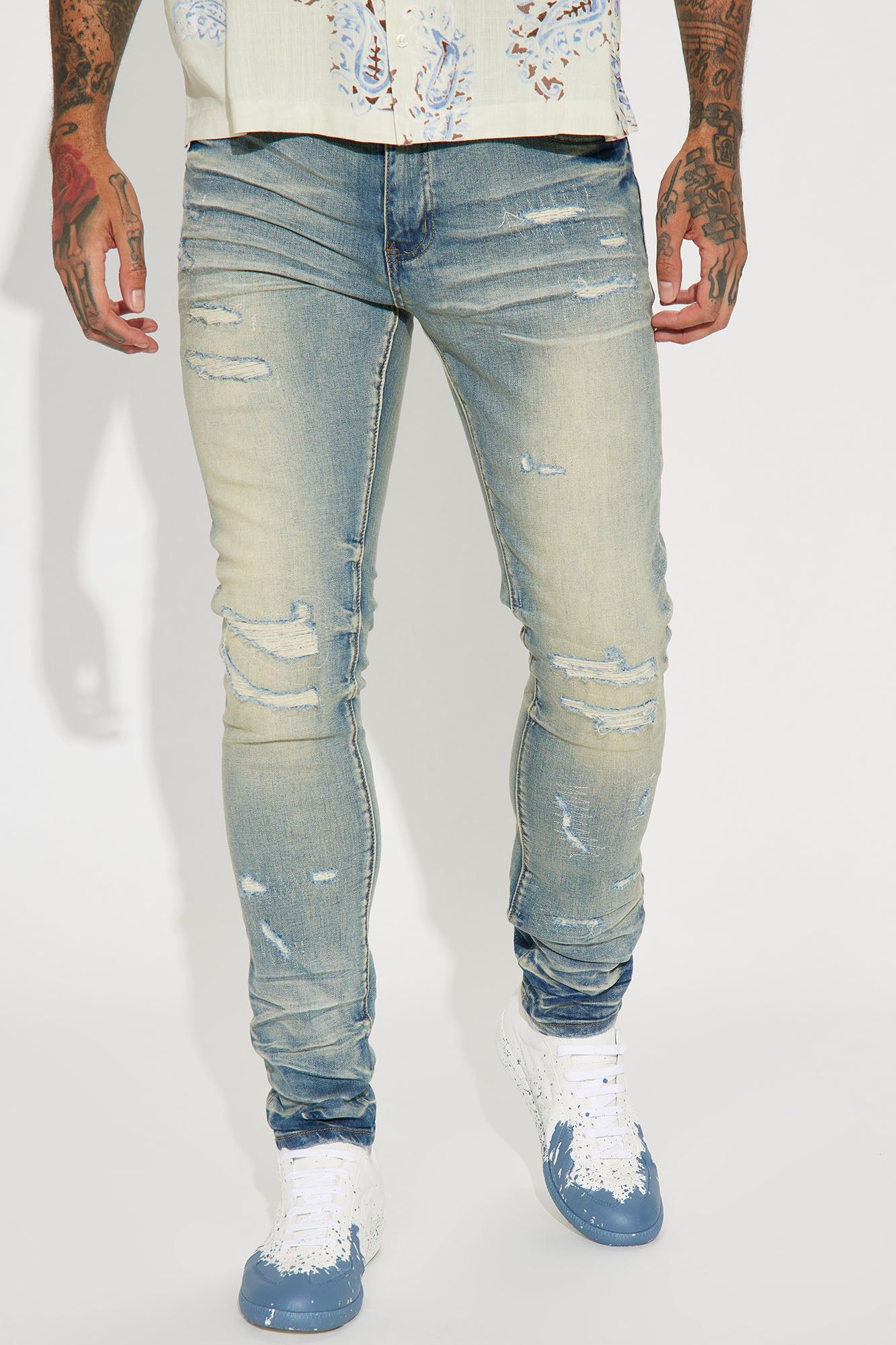 Street Rising Ripped Stacked Skinny Jeans - Medium Wash sold by Fashion Nova