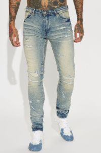 Street Rising Ripped Stacked Skinny Jeans - Medium Wash sold by Fashion Nova