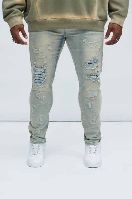 Above It All Ripped Stacked Skinny Jeans - Vintage Blue Wash sold by Fashion Nova