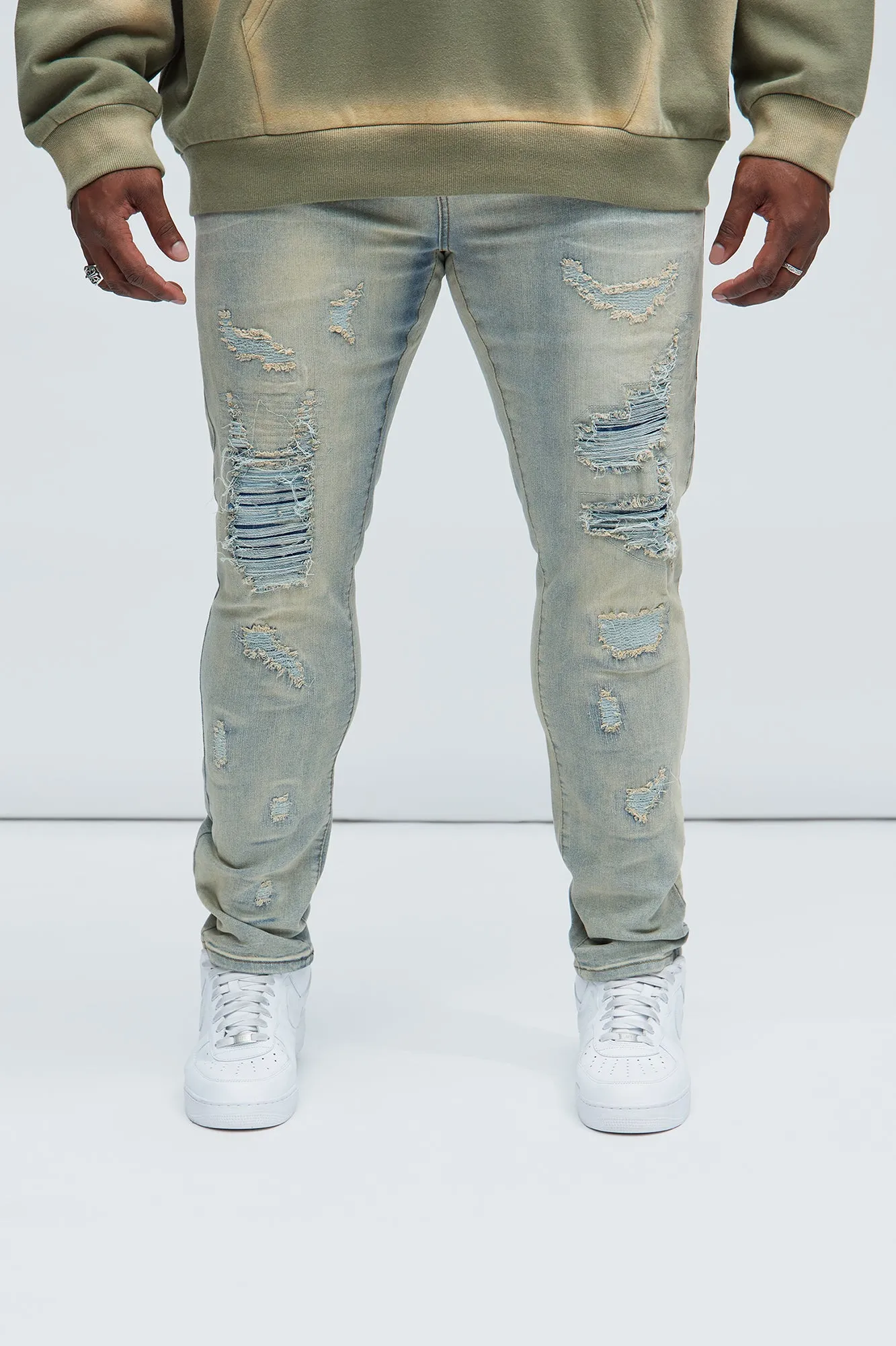 Above It All Ripped Stacked Skinny Jeans - Vintage Blue Wash sold by Fashion Nova