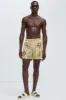 Moving Onward Swim Trunks - Tan sold by Fashion Nova