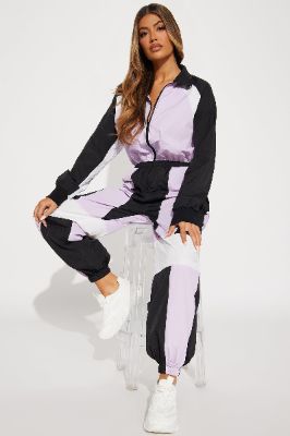 First Place Windbreaker Jumpsuit - Purple/combo sold by Fashion Nova