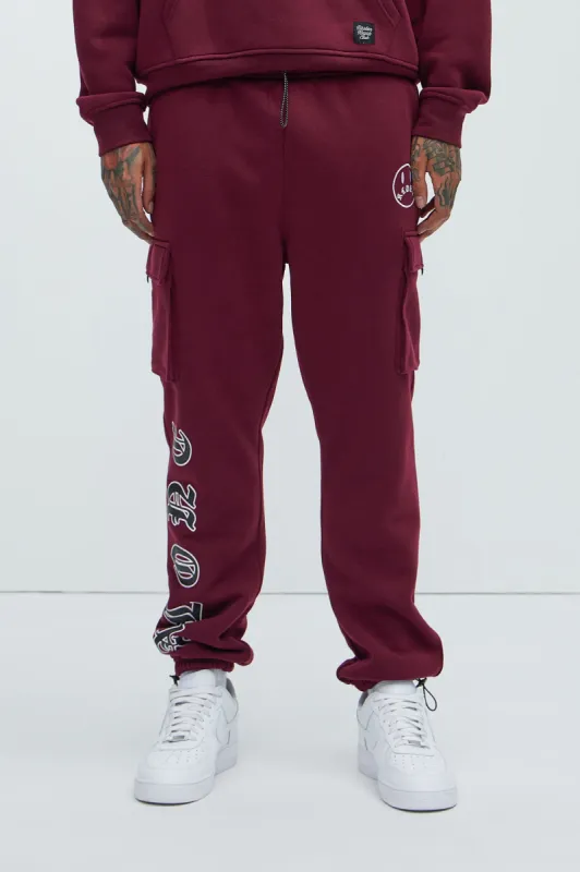 Never Alone Cargo Sweatpant - Burgundy sold by Fashion Nova
